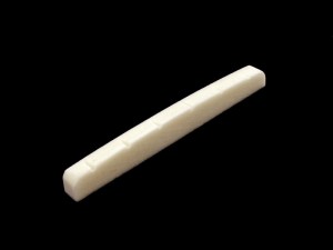 Allparts flat bottom slotted bone nut.